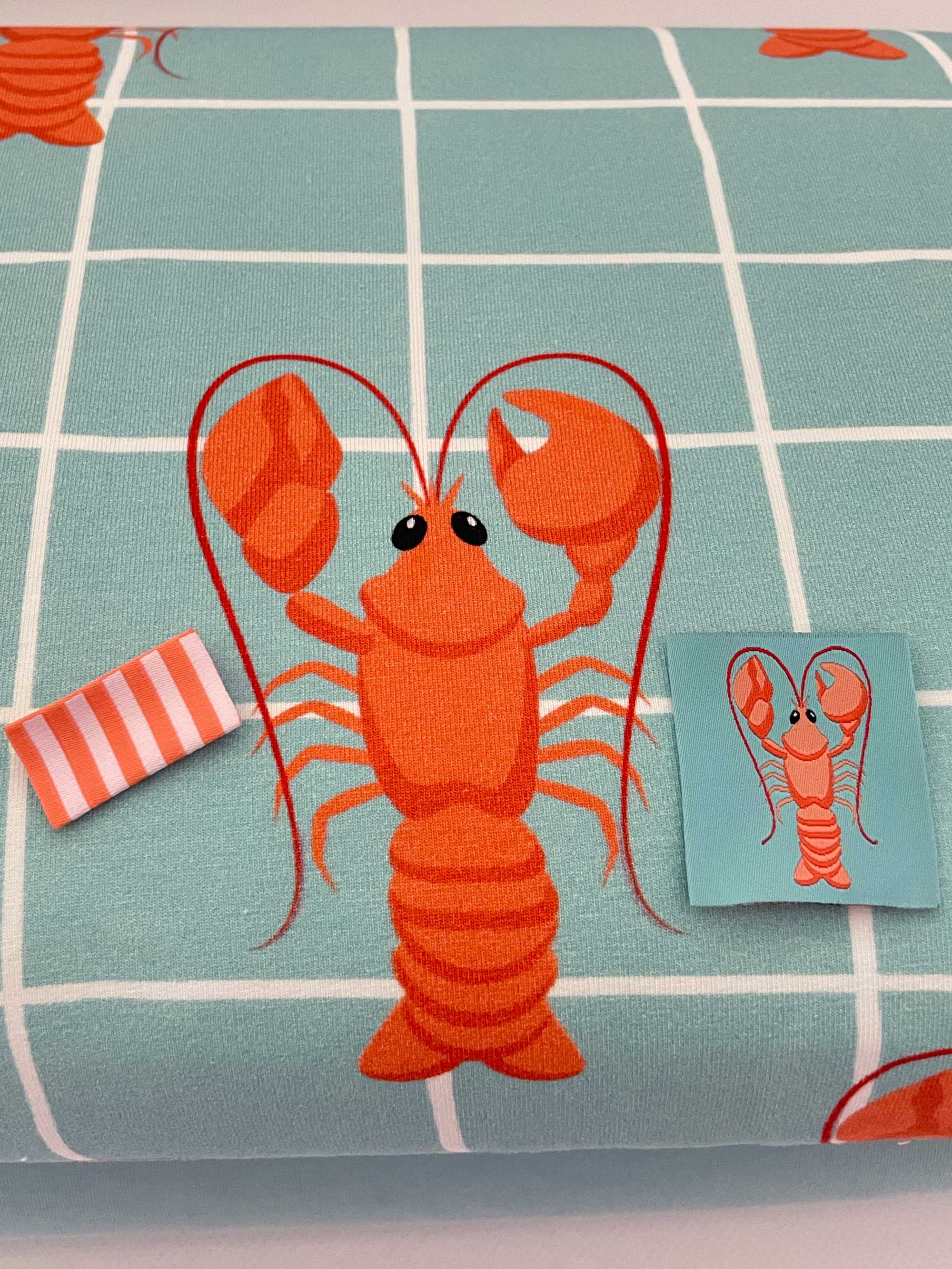 Lobster Geweven kledinglabel | Oranje & turquoise