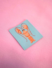 Lobster Geweven kledinglabel | Oranje & turquoise